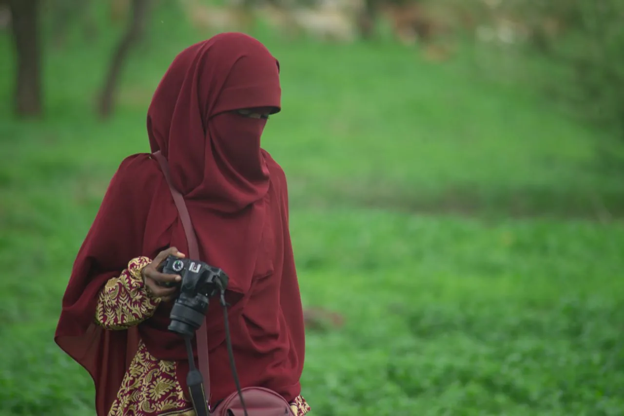 A participant photographing a portrait out in the field.